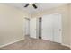 Spacious bedroom with double-door closet and ceiling fan at 2155 W Scully Dr, Phoenix, AZ 85023