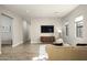 Relaxing living room with beige sofa and large TV at 24882 N 124Th St, Scottsdale, AZ 85255