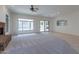Bright living room with fireplace, carpet, and lots of natural light at 2223 E Branham Ln, Phoenix, AZ 85042