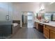 Elegant bathroom featuring a large walk-in shower and double vanity at 2223 E Branham Ln, Phoenix, AZ 85042