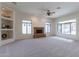 Living room with a fireplace and built-in shelving at 2223 E Branham Ln, Phoenix, AZ 85042