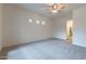 Spacious bedroom with ceiling fan and access to bathroom at 2223 E Branham Ln, Phoenix, AZ 85042