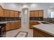 Kitchen with wood cabinets and quartz countertops at 2223 E Branham Ln, Phoenix, AZ 85042