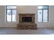 Stone fireplace in the living room with built-in shelving at 2223 E Branham Ln, Phoenix, AZ 85042