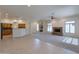 Open living room with fireplace and kitchen views at 2223 E Branham Ln, Phoenix, AZ 85042