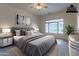 Primary bedroom with virtually staged furniture at 2223 E Branham Ln, Phoenix, AZ 85042