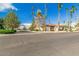 Community street view showing nicely landscaped areas and buildings at 9327 E Sun Lakes Blvd, Sun Lakes, AZ 85248