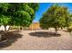 Landscaped backyard with gravel and trees at 9327 E Sun Lakes Blvd, Sun Lakes, AZ 85248