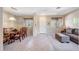 Open living and dining area with neutral color palette and tiled floors at 17518 W Desert Sage Dr, Goodyear, AZ 85338