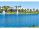 Scenic lake view with fountains and lush landscaping at 17518 W Desert Sage Dr, Goodyear, AZ 85338