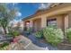 Covered porch with seating area, offering a relaxing outdoor space at 17518 W Desert Sage Dr, Goodyear, AZ 85338