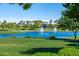 Lakefront view with fountains and lush landscaping at 17518 W Desert Sage Dr, Goodyear, AZ 85338