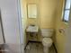 Small bathroom with a sink, toilet, and medicine cabinet at 1202 S 14Th St, Phoenix, AZ 85034