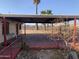 Small patio area with red flooring and partial cover at 1202 S 14Th St, Phoenix, AZ 85034