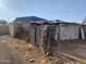 Rear view of the property, showing the back of the house and a fence at 1202 S 14Th St, Phoenix, AZ 85034