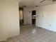 Living room with tiled floors and a view of the kitchen at 1202 S 14Th St, Phoenix, AZ 85034