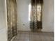 Bedroom with tiled floors and patterned curtains at 1202 S 14Th St, Phoenix, AZ 85034