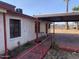 View of the house's side, showcasing a covered patio area at 1202 S 14Th St, Phoenix, AZ 85034