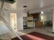 Open living area with damaged ceiling and bikes at 1202 S 14Th St, Phoenix, AZ 85034
