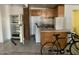 Dated kitchen features wood cabinets, appliances, and a breakfast bar at 1202 S 14Th St, Phoenix, AZ 85034