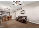 Open living room with a view to kitchen and dining area at 8752 E Plata Ave, Mesa, AZ 85212