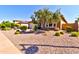 Single-story home with a gravel yard and mature trees at 31207 N 124Th Dr, Peoria, AZ 85383