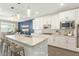 Virtually staged kitchen with white cabinets, granite countertops, and an island at 2929 W Amber Sun Dr, Phoenix, AZ 85085