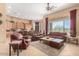 Spacious living room with leather furniture and a fireplace at 40010 N Candlewyck Ln, Phoenix, AZ 85086