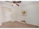 Spacious bedroom with neutral walls, ceiling fan, and plush carpeting at 22227 S 214Th St, Queen Creek, AZ 85142