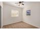 Well-lit bedroom featuring a ceiling fan and window blinds at 22227 S 214Th St, Queen Creek, AZ 85142