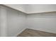 Large walk-in closet with wood shelving at 17931 N 93Rd Way, Scottsdale, AZ 85255