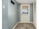 Interior entry with a rustic door and tiled floor at 4628 E Holly St, Phoenix, AZ 85008