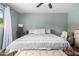 Bright bedroom with a comfortable bed and seating at 4628 E Holly St, Phoenix, AZ 85008