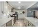 Modern kitchen with white cabinets and stainless steel appliances at 4628 E Holly St, Phoenix, AZ 85008