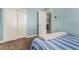 Bedroom with a twin bed, closet and view into another room at 4628 E Holly St, Phoenix, AZ 85008
