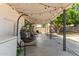 Relaxing patio area with hanging chairs and string lights under a covered structure at 4628 E Holly St, Phoenix, AZ 85008