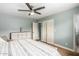 Main bedroom with ceiling fan, built-in dresser and closet at 4628 E Holly St, Phoenix, AZ 85008
