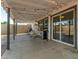 Covered patio with string lights, comfortable seating, and access to the house at 4628 E Holly St, Phoenix, AZ 85008