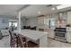 Modern kitchen with white cabinets, quartz counters, and stainless steel appliances at 4628 E Holly St, Phoenix, AZ 85008