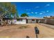 Front view of a Ranch style home with a carport at 4628 E Holly St, Phoenix, AZ 85008