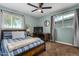 Bedroom with a double bed, desk and window with blinds at 4628 E Holly St, Phoenix, AZ 85008