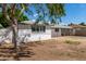 Side view of the house showcasing landscaping and fence at 4628 E Holly St, Phoenix, AZ 85008