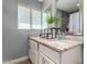 Double sink bathroom with granite countertop and large mirror at 4628 E Holly St, Phoenix, AZ 85008
