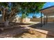 Landscaped backyard with a fire pit and a covered patio at 4628 E Holly St, Phoenix, AZ 85008