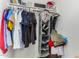 Well-organized closet with hanging rods and shoe storage at 4628 E Holly St, Phoenix, AZ 85008