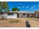Ranch-style home with a carport and well-maintained yard at 4628 E Holly St, Phoenix, AZ 85008