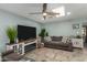 Cozy living room featuring a fireplace and large TV at 4628 E Holly St, Phoenix, AZ 85008