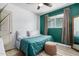 Bedroom with a double bed and teal colored accent wall at 4628 E Holly St, Phoenix, AZ 85008