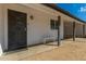 Front entry with a decorative door and a small bench at 4628 E Holly St, Phoenix, AZ 85008