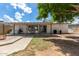 Spacious backyard features a covered patio and a brick walkway at 4628 E Holly St, Phoenix, AZ 85008